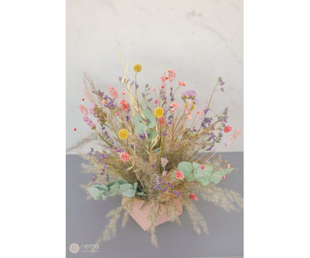 Dried flower arrangement in concrete vases