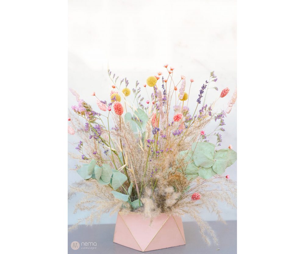 Dried flower arrangement in concrete vases