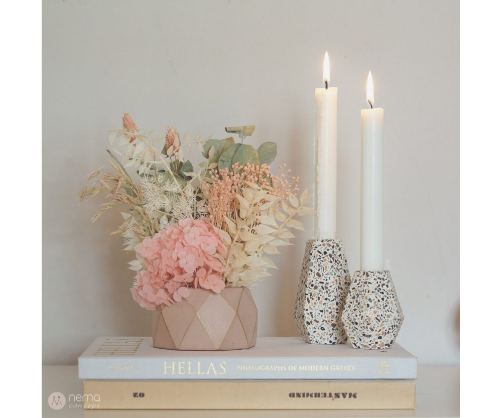 Dried flower arrangement in concrete vases