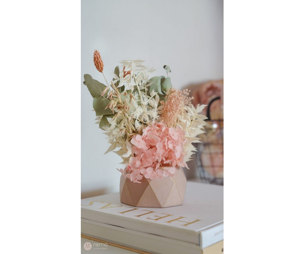 Dried flower arrangement in concrete vases