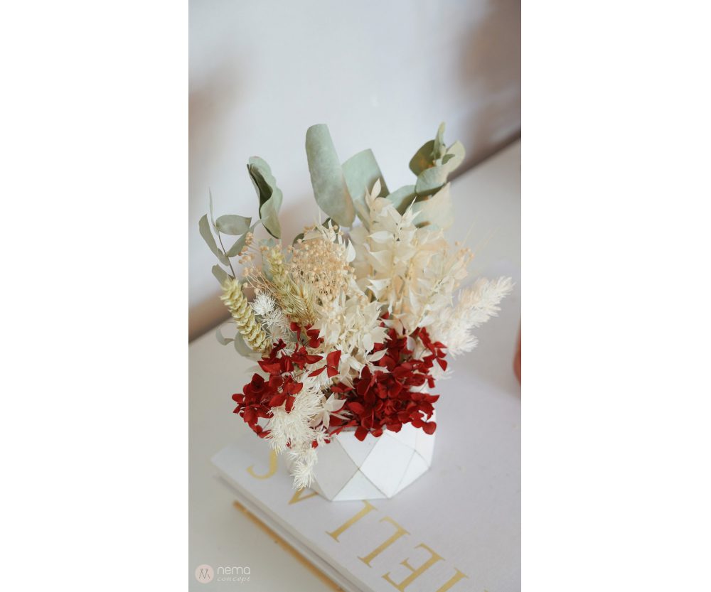 Dried flower arrangement in concrete vases