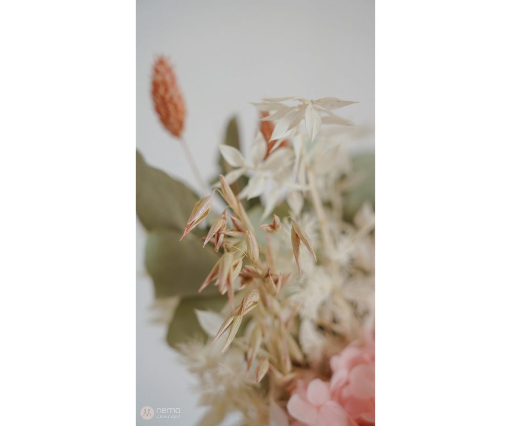 Dried flower arrangement in concrete vases