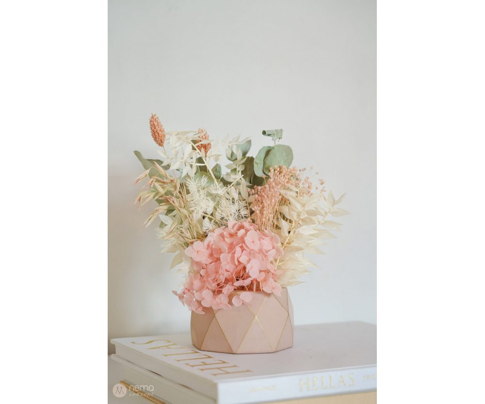 Dried flower arrangement in concrete vases