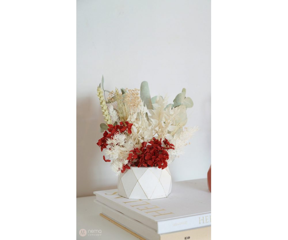 Dried flower arrangement in concrete vases