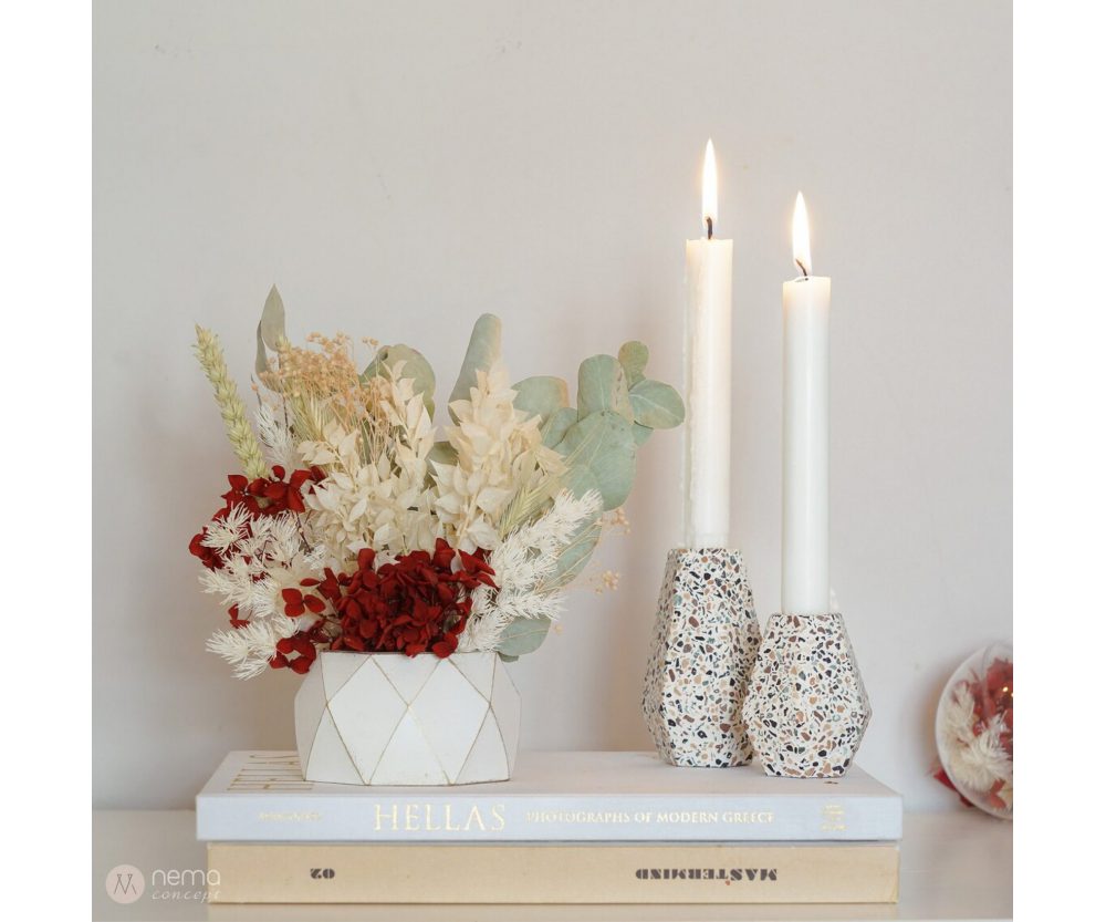 Dried flower arrangement in concrete vases