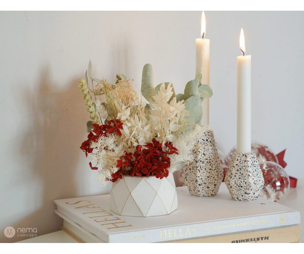 Dried flower arrangement in concrete vases