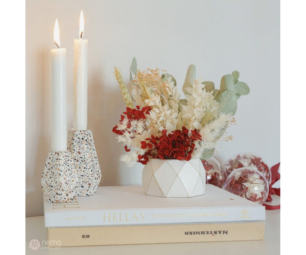 Dried flower arrangement in concrete vases