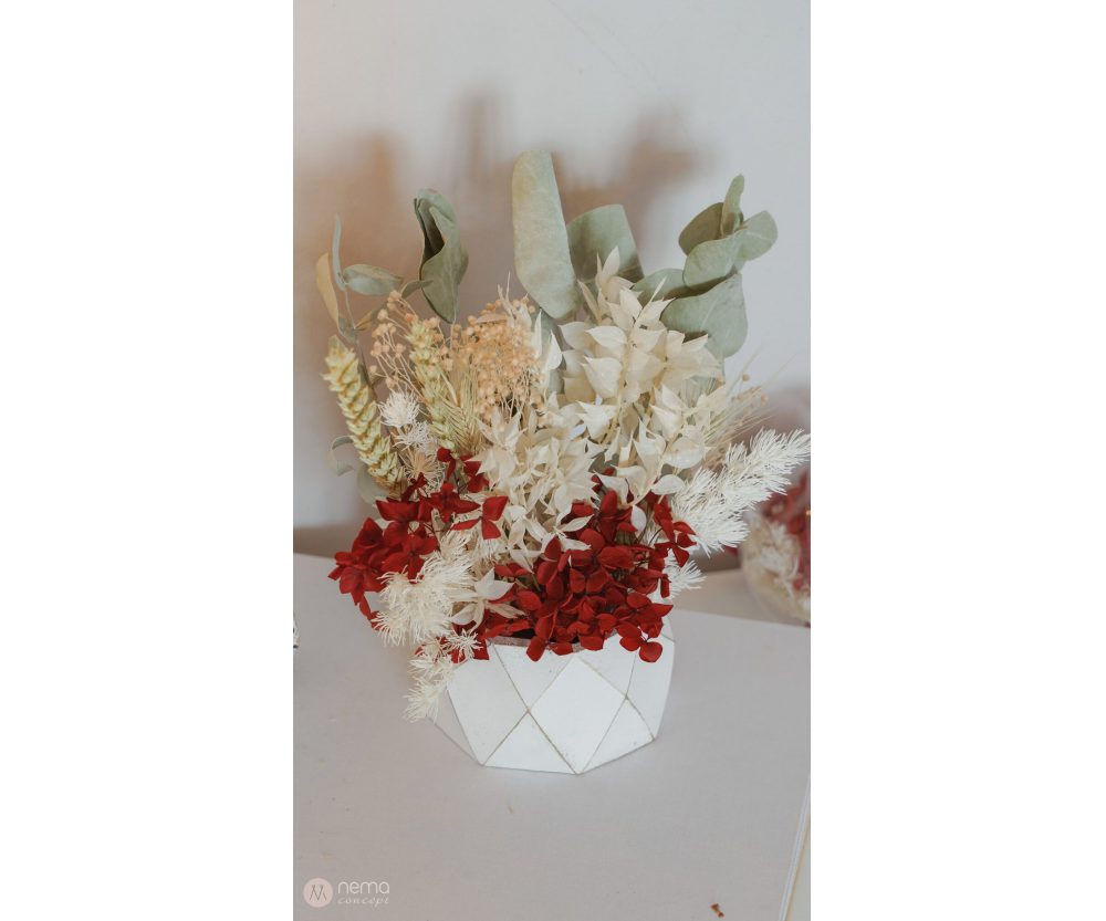 Dried flower arrangement in concrete vases