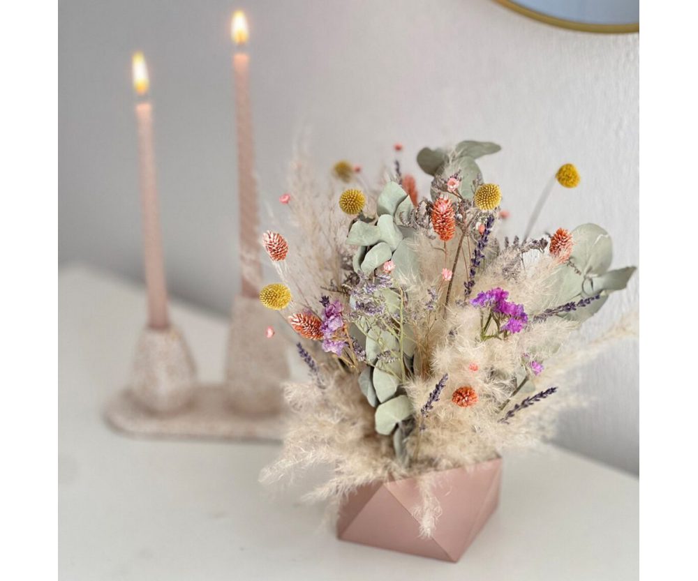 Dried flower arrangement in concrete vases