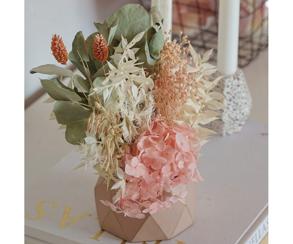 Dried flower arrangement in concrete vases