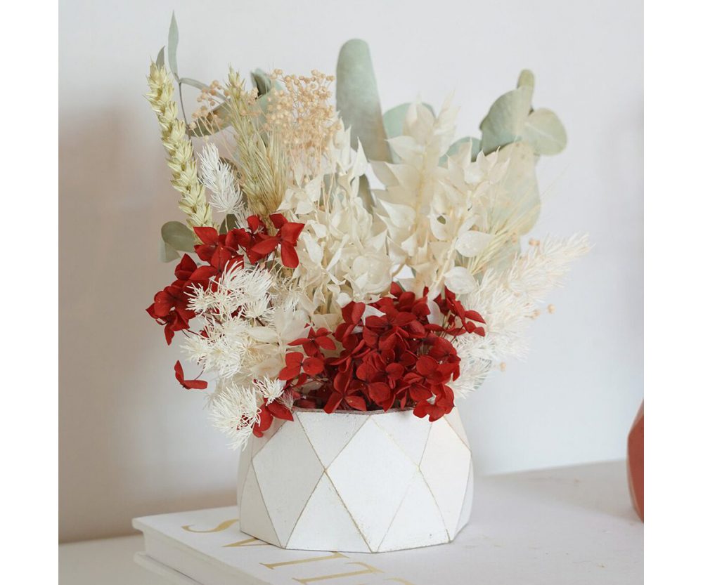 Dried flower arrangement in concrete vases